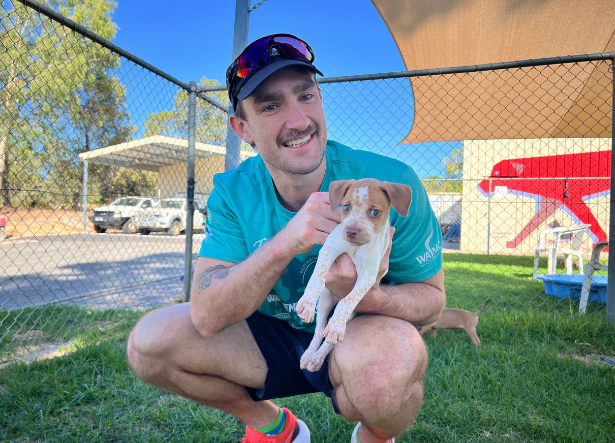 Ambaasador Connor Webster headshot - holding a puppy at RSPCA WA yard