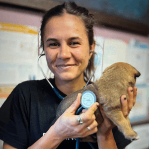 2025 AWA volunteer winner Amy Haskins - holding puppy with stethoscope
