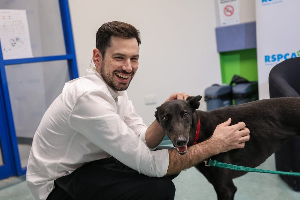 Ambassador Beau Pearson headshot with dog at RSPCA WA